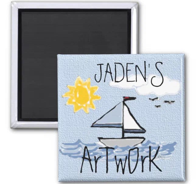 A square magnet drawn by children, featuring a sailboat on the water, a yellow sun, and birds in the sky. The text reads